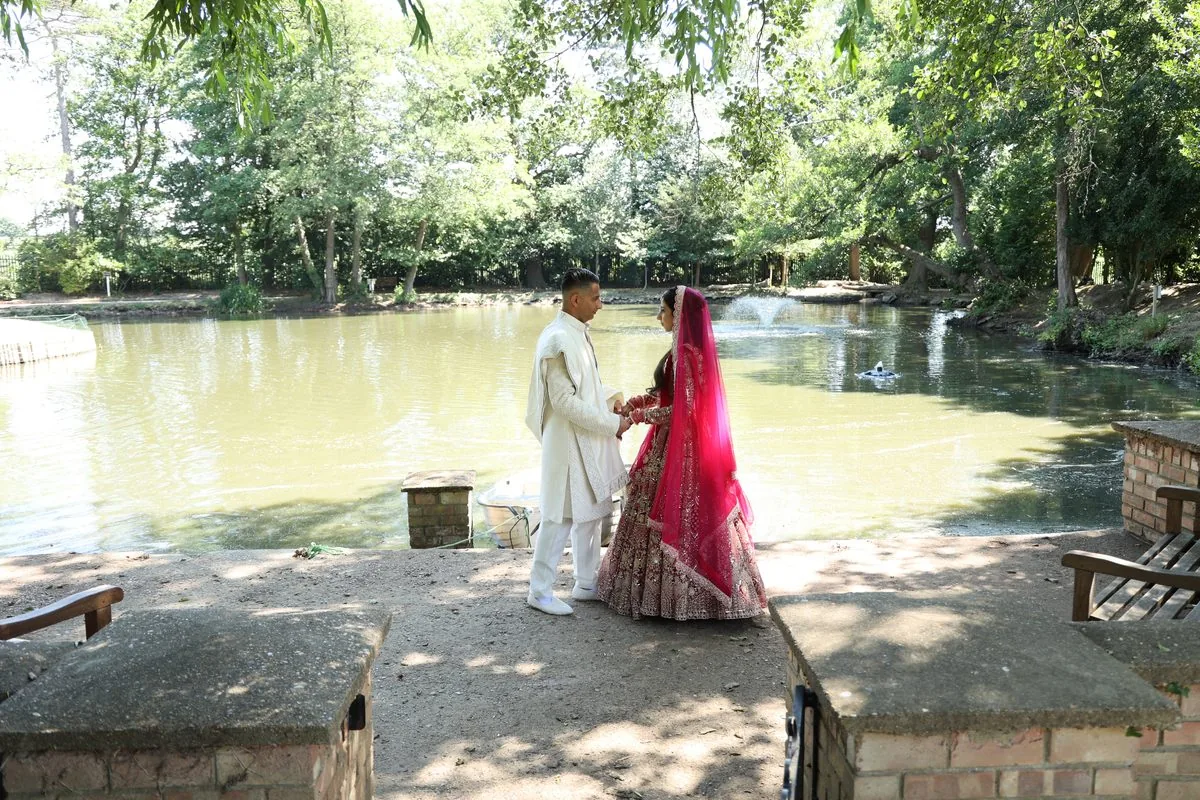 Family dancing to the dhol during a baraat procession