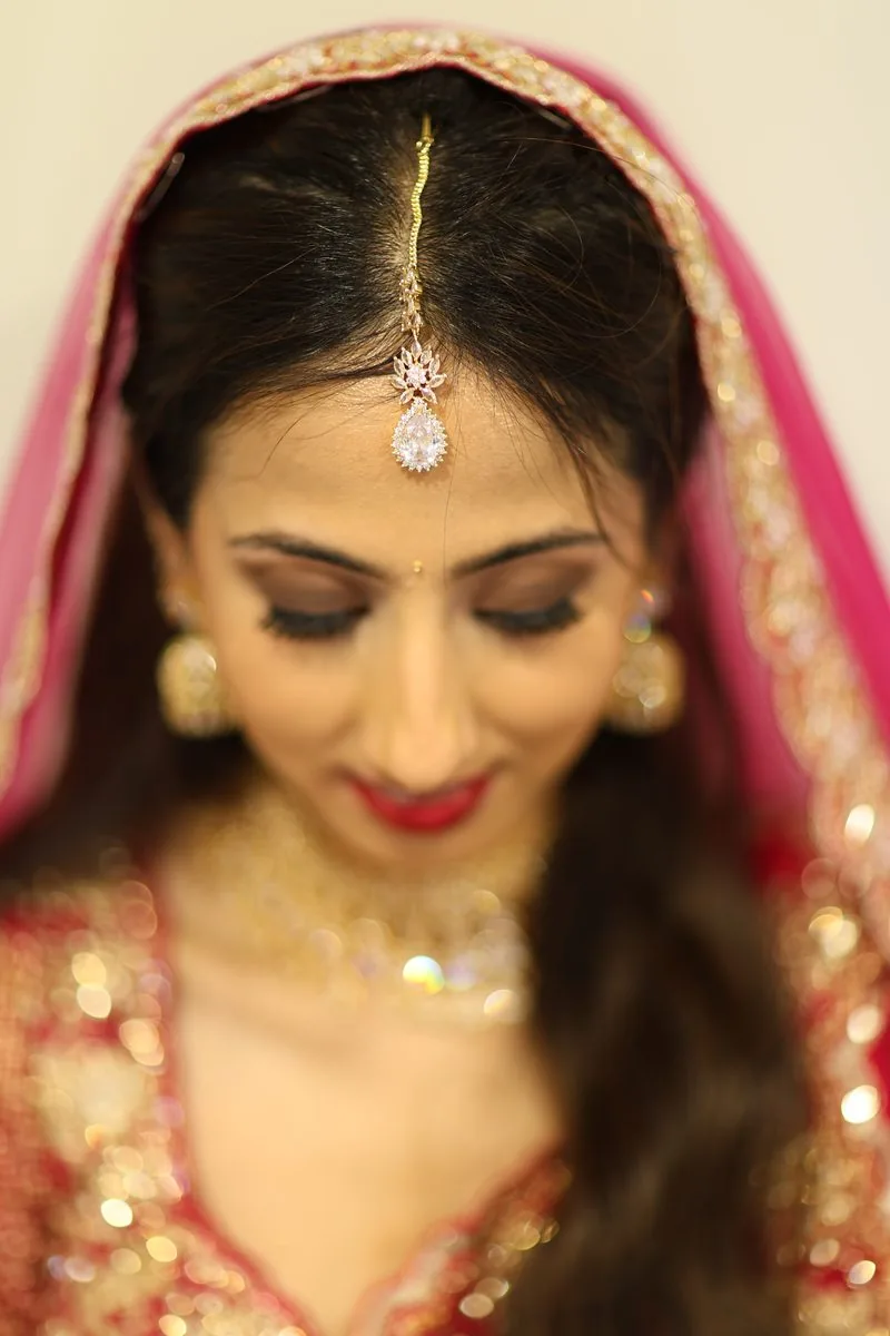 Two photographers covering different moments at a wedding