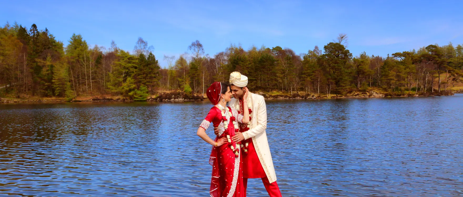 Bride and groom beside a lake, groom in a turban