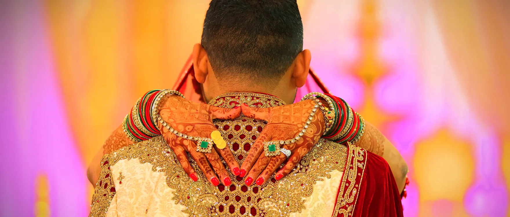 Groom photographed from behind in an embroidered sherwani