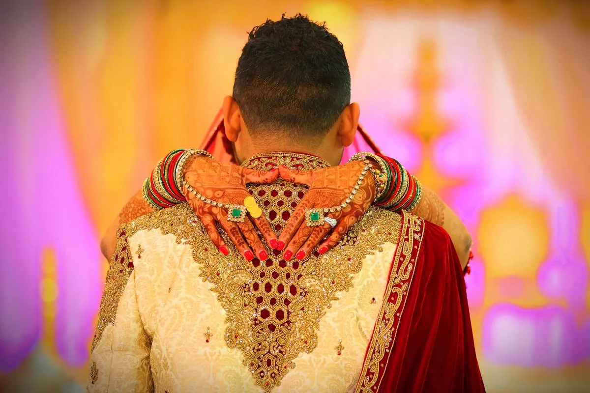 Bride's hands with intricate mehndi henna designs