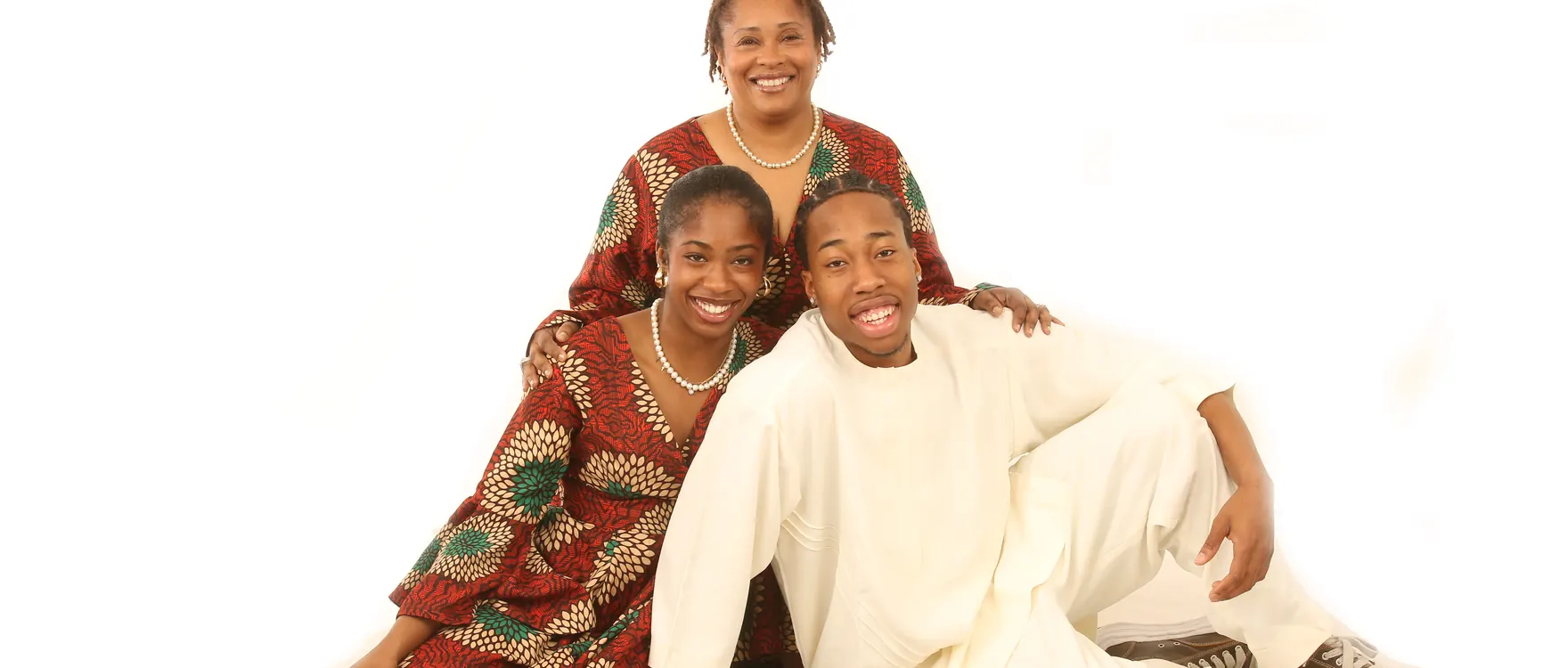 Mother with her two grown children seated together in the studio