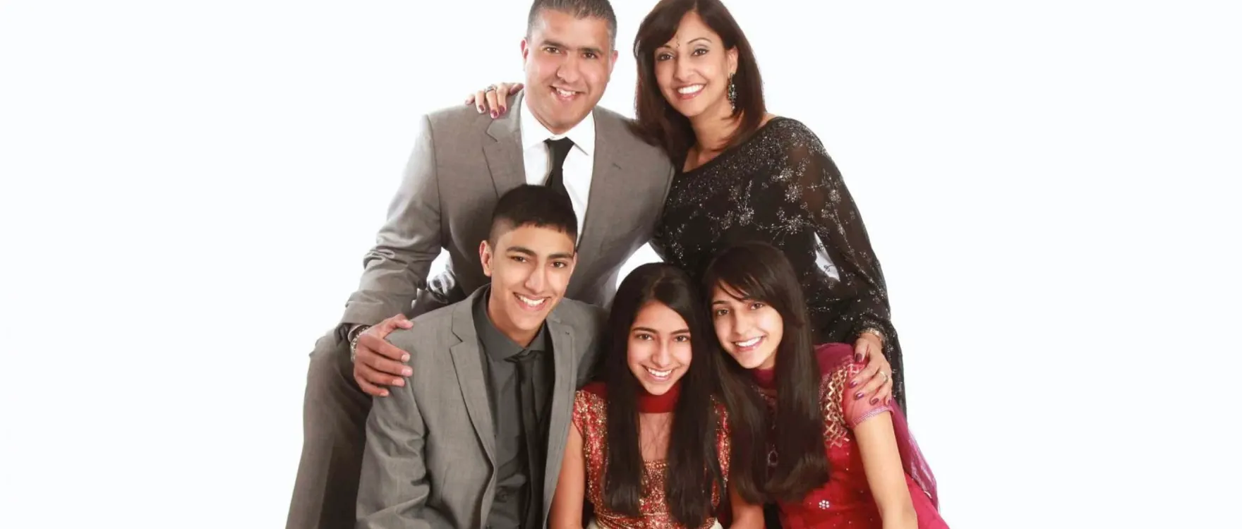 Family of five in grey, black and red, studio group portrait