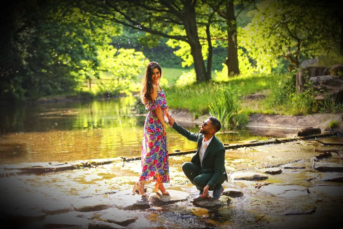 Relaxed engaged couple laughing during a pre-wedding shoot