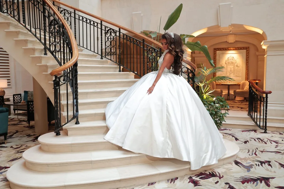 A wedding album open to a beautifully designed spread